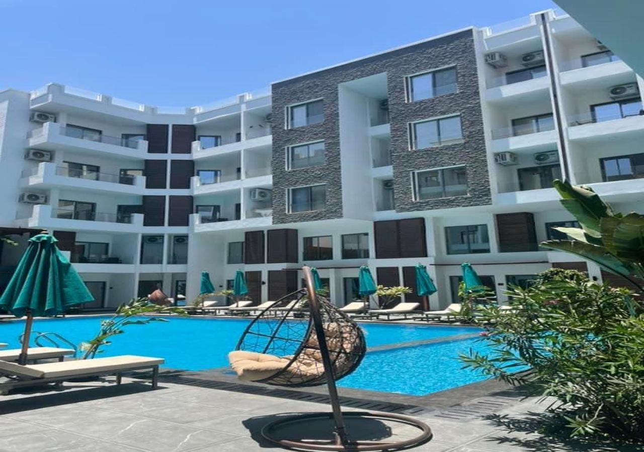 Sanctuary Sunlit Hurghada Haven With 4 Pools, Rooftop Sunsets & Gourmet Bites Steps Away Bagian luar foto