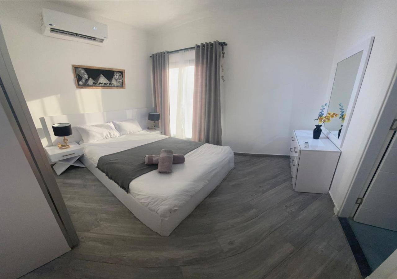 Sanctuary Sunlit Hurghada Haven With 4 Pools, Rooftop Sunsets & Gourmet Bites Steps Away Bagian luar foto