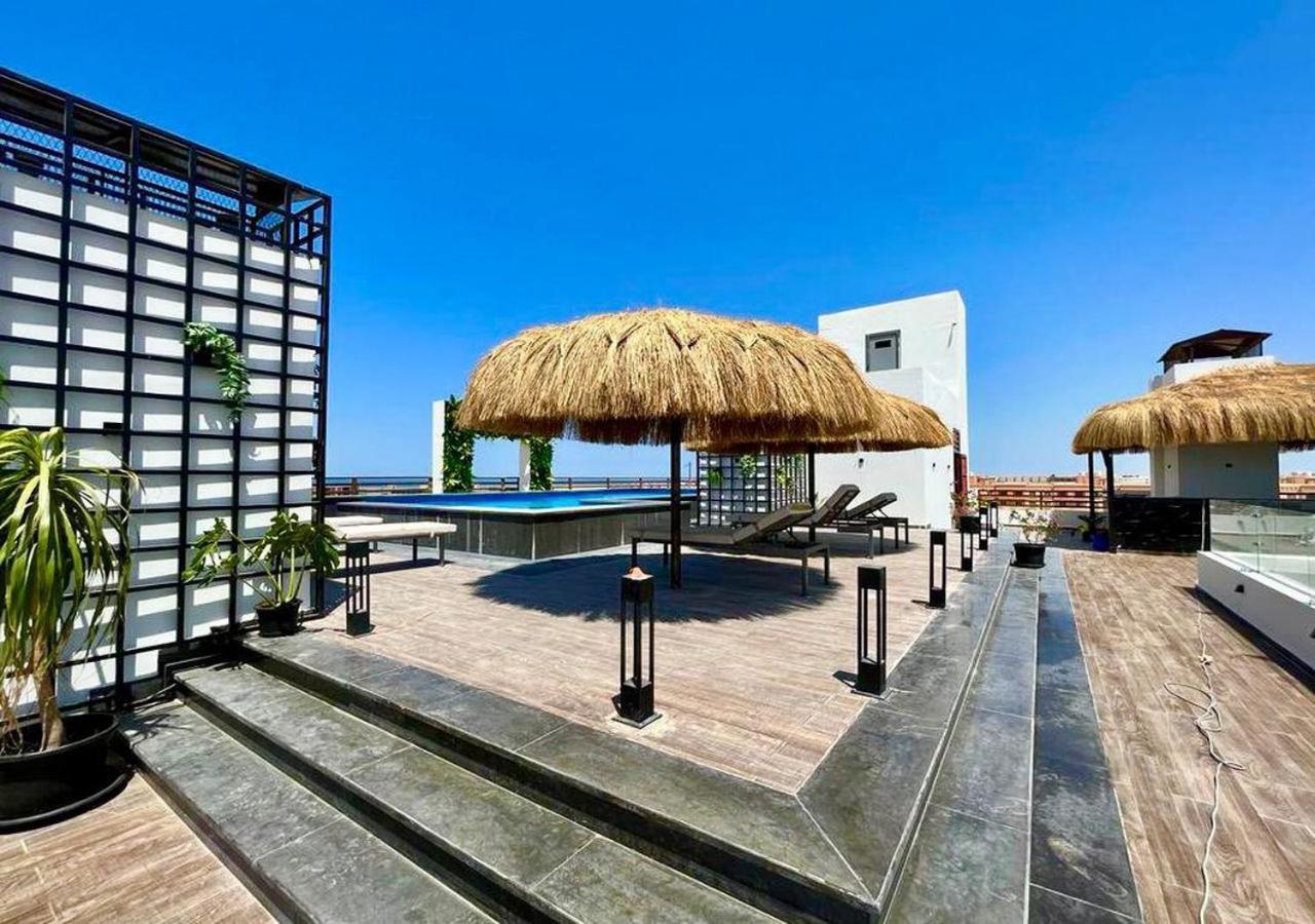 Sanctuary Sunlit Hurghada Haven With 4 Pools, Rooftop Sunsets & Gourmet Bites Steps Away Bagian luar foto